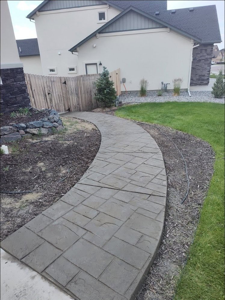 Herringbone brick stamped concrete driveway