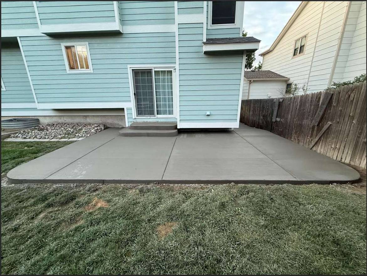 Colored concrete patio installation Colorado Springs - outdoor dining space